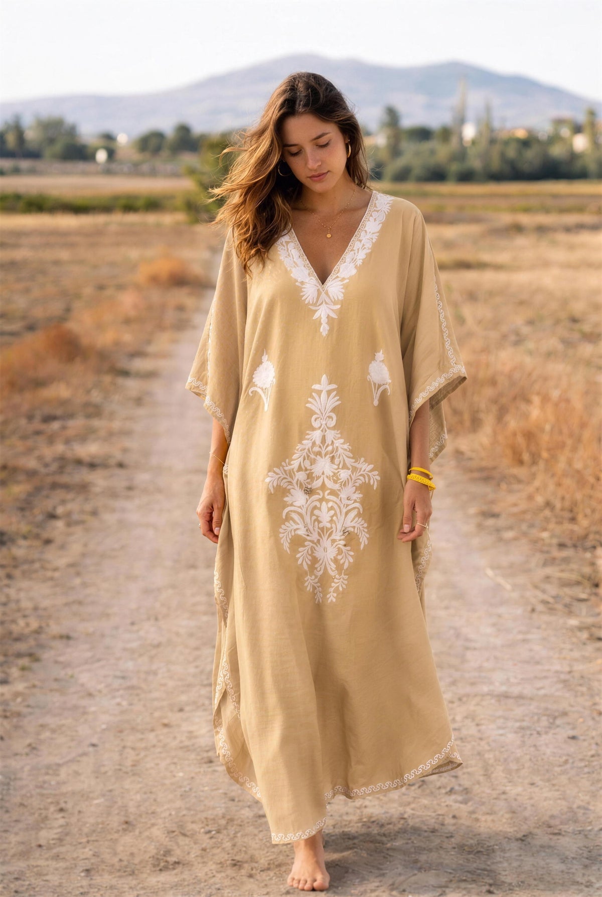 Woman walking outdoors in the cappuccino Kashmir cotton butterfly kaftan