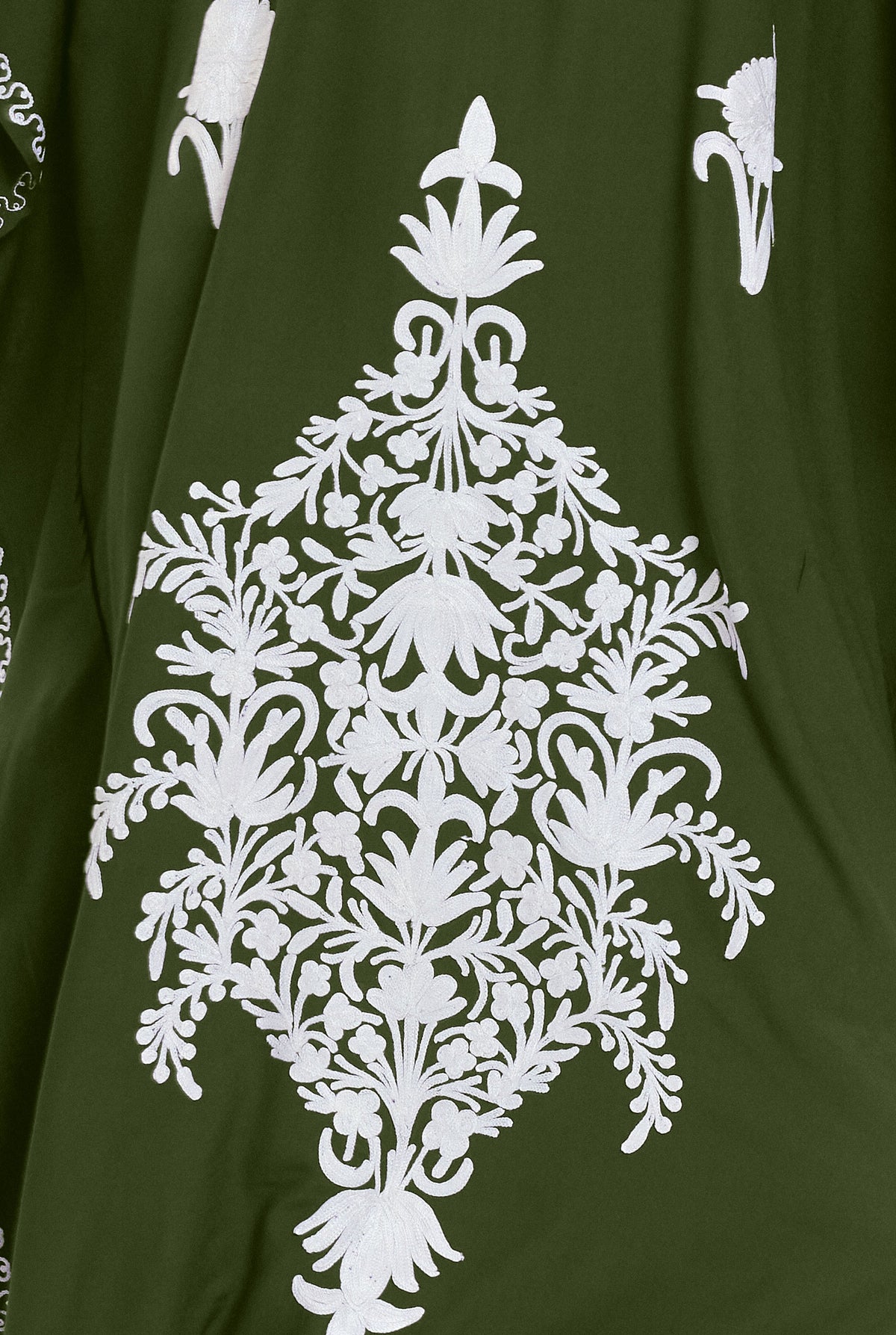 Detail of the ivory hand-embroidered floral panel on the olive Kashmir cotton kaftan