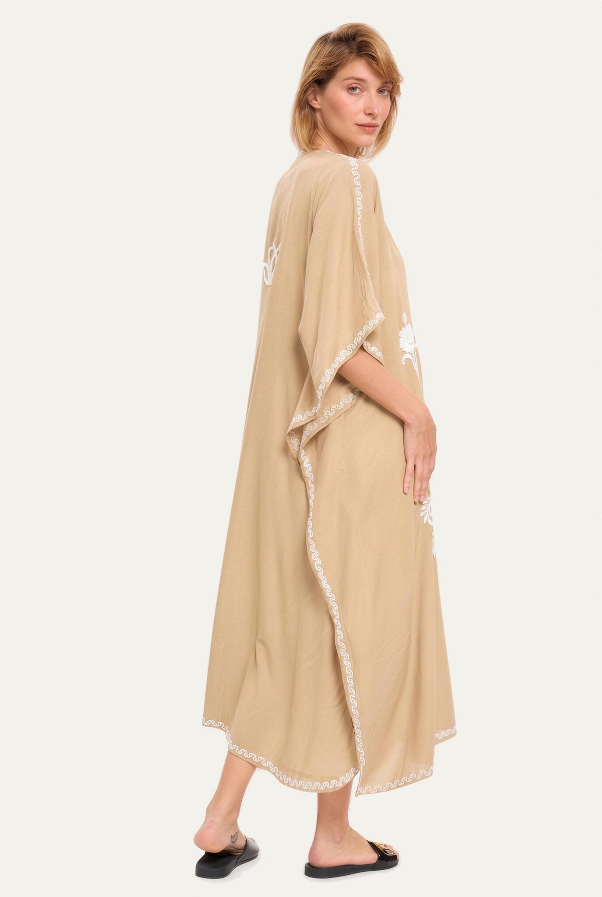 Model wearing the sand Kashmir cotton kaftan, side view