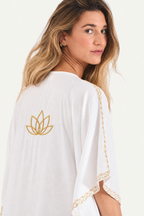 Close view of the mustard gold lotus embroidery and sleeve trim on the Kashmir cotton butterfly kaftan